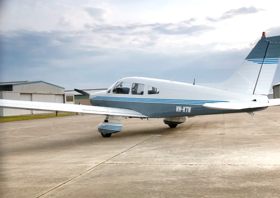 VH-KTN side profile outside the hangars