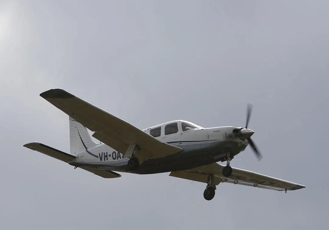 Saratoga in flight with landing gear lowered